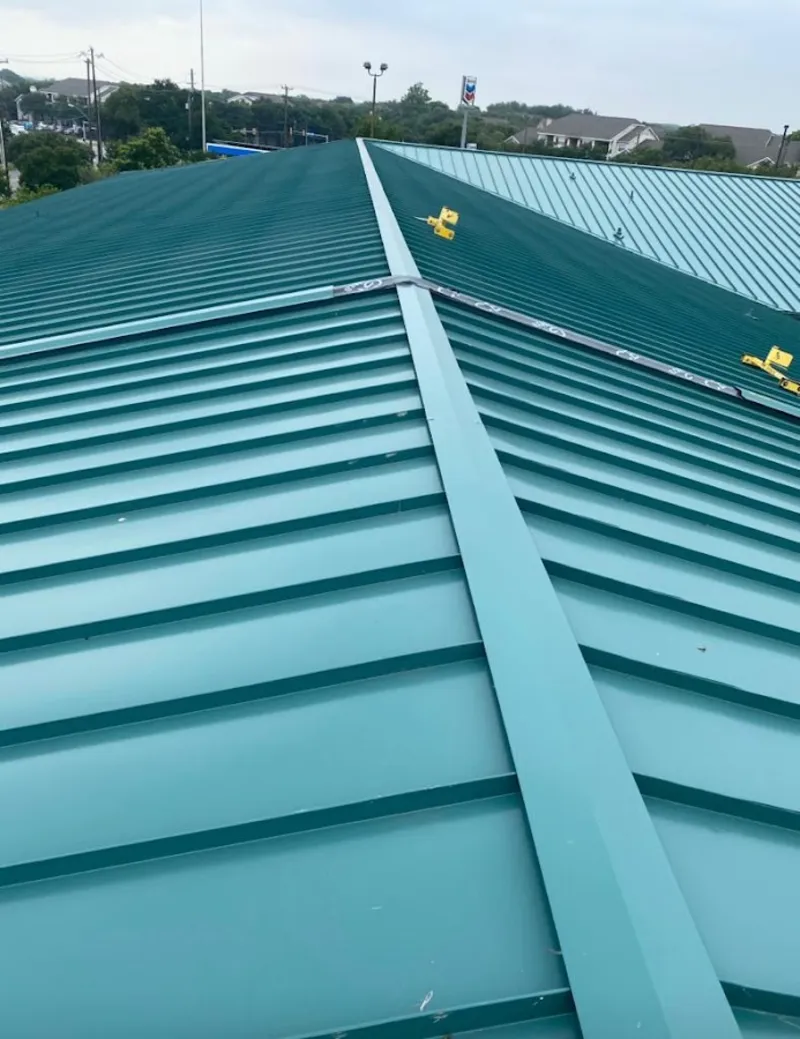 Green commercial metal roof ridge and valley for Metal Roof Repair in Kalispell